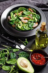 Salad of shrimps, spinach, and sunflower sprouts