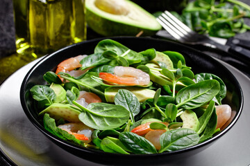 Salad of shrimps, spinach, and sunflower sprouts