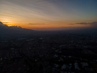 Fototapeta premium Beautiful aerial view of the City of San Jose Costa Rica, Its park Sabana, buildings at sunset 