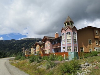 Fototapeta na wymiar colorful buildings in the ski area of Sun Peaks, British Columbia, Canada, August