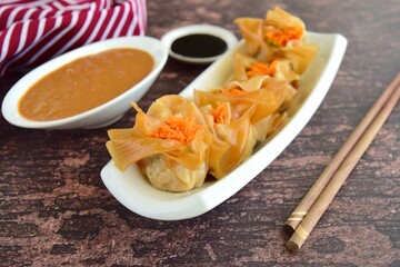 Siomay, Indonesian Food, steamed dumplings with peanut sauce and thick soy sauce or kecap manis