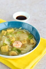 Prawn wonton soup with tofu and bean sprouts

