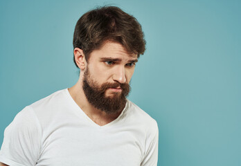 Portrait cropped view of male bushy beard brunette model