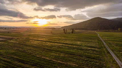 Obraz premium Aerial view of empty autumn fields at sunset.