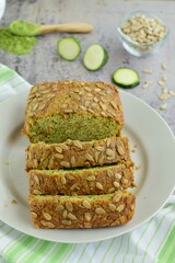 Slices of wheatgrass zucchini bread with sunflower seeds