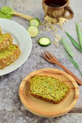 Slices of wheatgrass zucchini bread with sunflower seeds