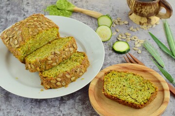 Slices of wheatgrass zucchini bread with sunflower seeds