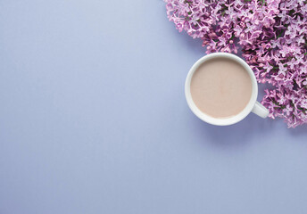 blue spring flowers lilac, cup of coffee with milk, place for text, spring texture