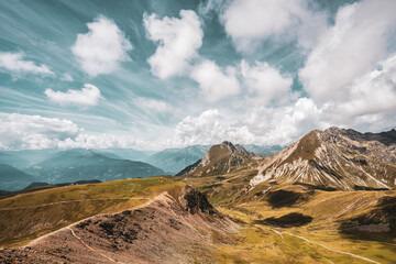 panoramic view of the Dolomites with beautiful weather clouds , Italy.