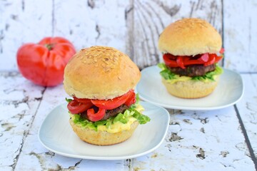 Beef burger with red bell pepper, lettuce and mustard mayonnaise sauce