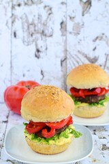 Beef burger with red bell pepper, lettuce and mustard mayonnaise sauce