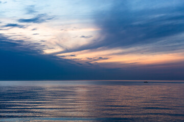 cloudy landscape in the lake and the sea with kayaks