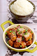 Stir fried diced tofu with soy sauce, sesame seeds and chives. Served with white rice