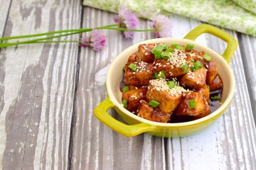 Diced tofu with soy sauce, sesame seed and chives.