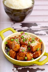 Stir fried diced tofu with soy sauce, sesame seeds and chives. Served with white rice