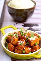 Stir fried diced tofu with soy sauce, sesame seeds and chives. Served with white rice