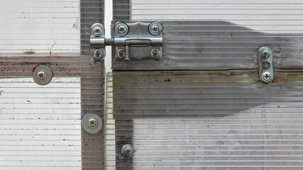 door bolt of a greenhouse, metal and plastic, ready for gardening