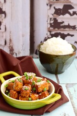 Stir fried diced tofu with soy sauce, sesame seeds and chives. Served with white rice