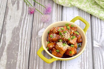 Diced tofu with soy sauce, sesame seed and chives.