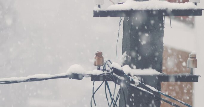 close-up . snow adhering to wires during snowfall.