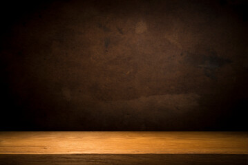 Selected focus empty brown wooden table and wall texture or old black brick wall blur background...