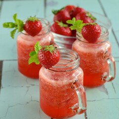 Fresh organic strawberry juice with mint in glass jar