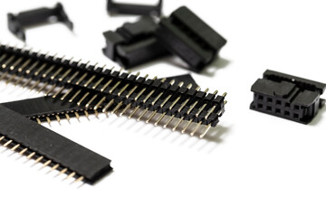 Electronics Components Ideas. Macro Shot of Long Straight PCB Connectors or Terminal Blocks Placed Bulk On White