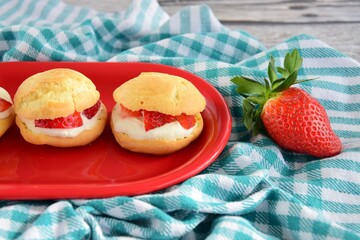 Choux pastry filled with whipped cream and strawberry