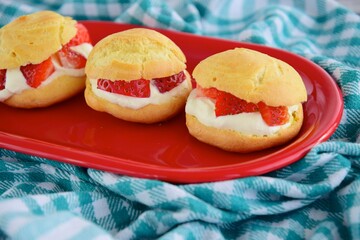 Choux pastry filled with whipped cream and strawberry