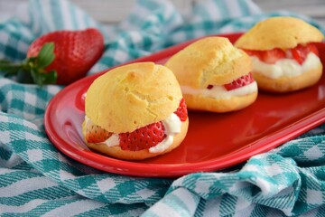 Choux pastry filled with whipped cream and strawberry