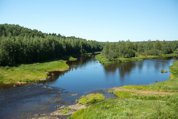 Fototapeta na wymiar View of the forest and river in summer in the North Russia.