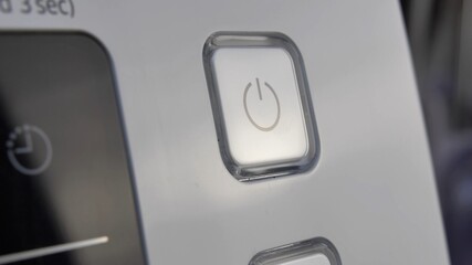 Pressing Stand By Power Button To Turn On and Off the Device Close-Up