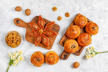 Traditional Azerbaijan holiday Novruz cookies baklava on the light  background with nuts and shekerbura,qogal,mutaki,flat lay,top view,space for copy