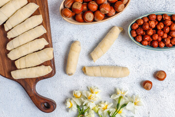 Traditional Azerbaijan holiday Novruz cookies baklava on the light  background with nuts and shekerbura,qogal,mutaki,flat lay,top view,space for copy
