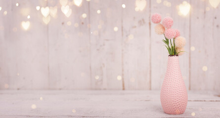 Flowers composition for Valentine's, Mother's or Women's Day. Pink flowers on old white wooden background. Still-life.