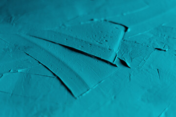 Smears of blue putty on the surface close-up