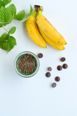 Spirulina mint banana smoothie with chocolate and chia seeds. White background