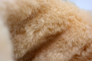 White light fur with wide fiber. Dense synthetic material. Warm, warming materials for winter things. 
