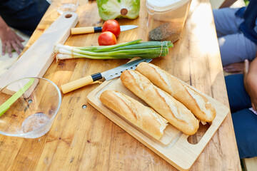 Baguette bread and ingredients for a salad