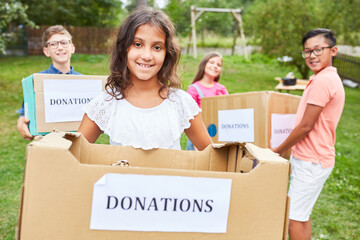 Children collect donations for clothing collection