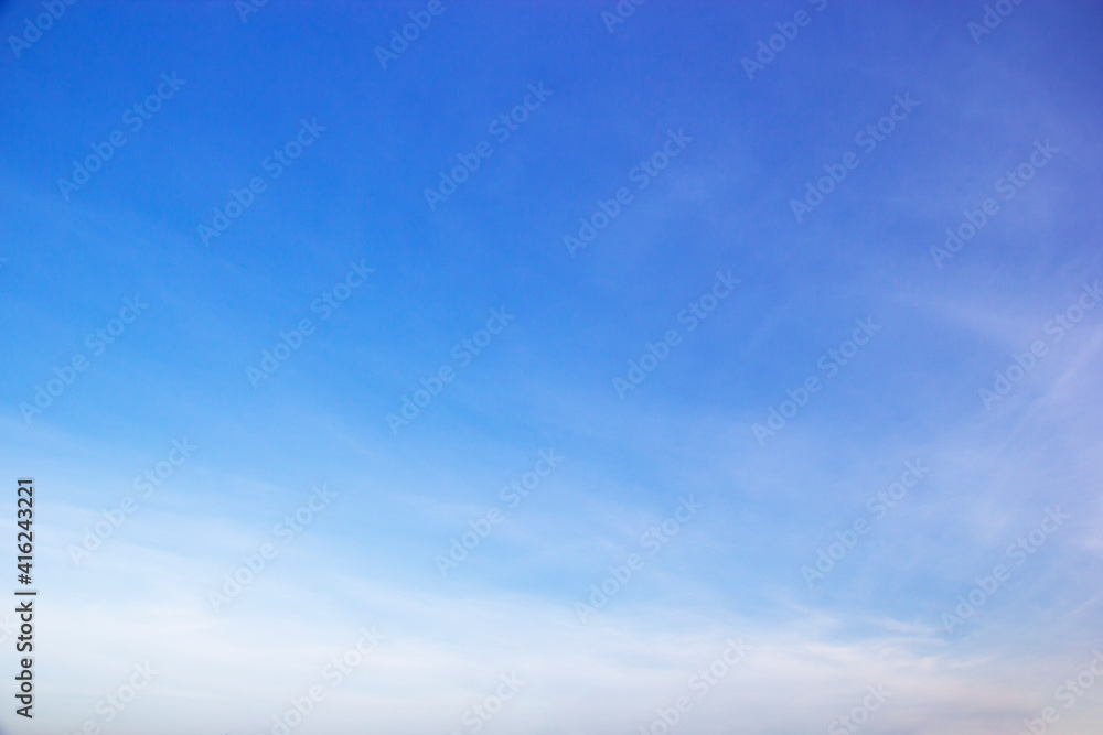Wall mural blue sky background and white clouds soft focus, and copy space horizontal