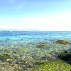 Fototapeta na wymiar Stunning view, crystal clear blue water & white sand beach at Gunung Payung Beach Bali Indonesia