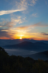 Scenic view of Mountains against sky during sunrise. Majestic sunrise over the mountains
