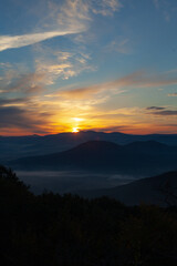 Scenic view of Mountains against sky during sunrise. Majestic sunrise over the mountains