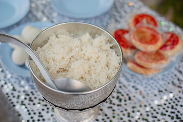 Make merit by offering food to monk in Thailand traditional wedding ceremony