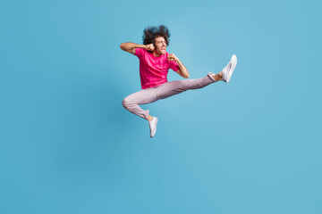 Fototapeta na wymiar Full length body size view of nice cheerful overjoyed guy jumping dancing contemporary ballet isolated over bright blue color background