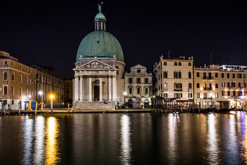 Fototapeta na wymiar Venice night view of the church of San Simeon Piccolo on the Grand Canal with the night lights reflecting in the water 