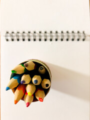 Notebook and pencils, objects on the table