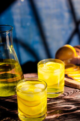 Fresh lemon juice. Moody background.