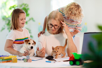 Mother working from home with kids. Quarantine.